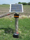 B180 Solar Energizer - wood post mount with battery on ground
